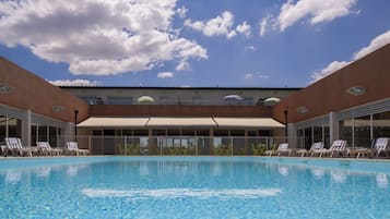 Seasonal outdoor pool, open 9:00 AM to 8:00 PM, pool umbrellas