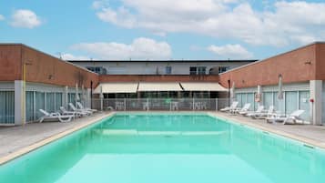 Seasonal outdoor pool, open 9:00 AM to 8:00 PM, pool umbrellas