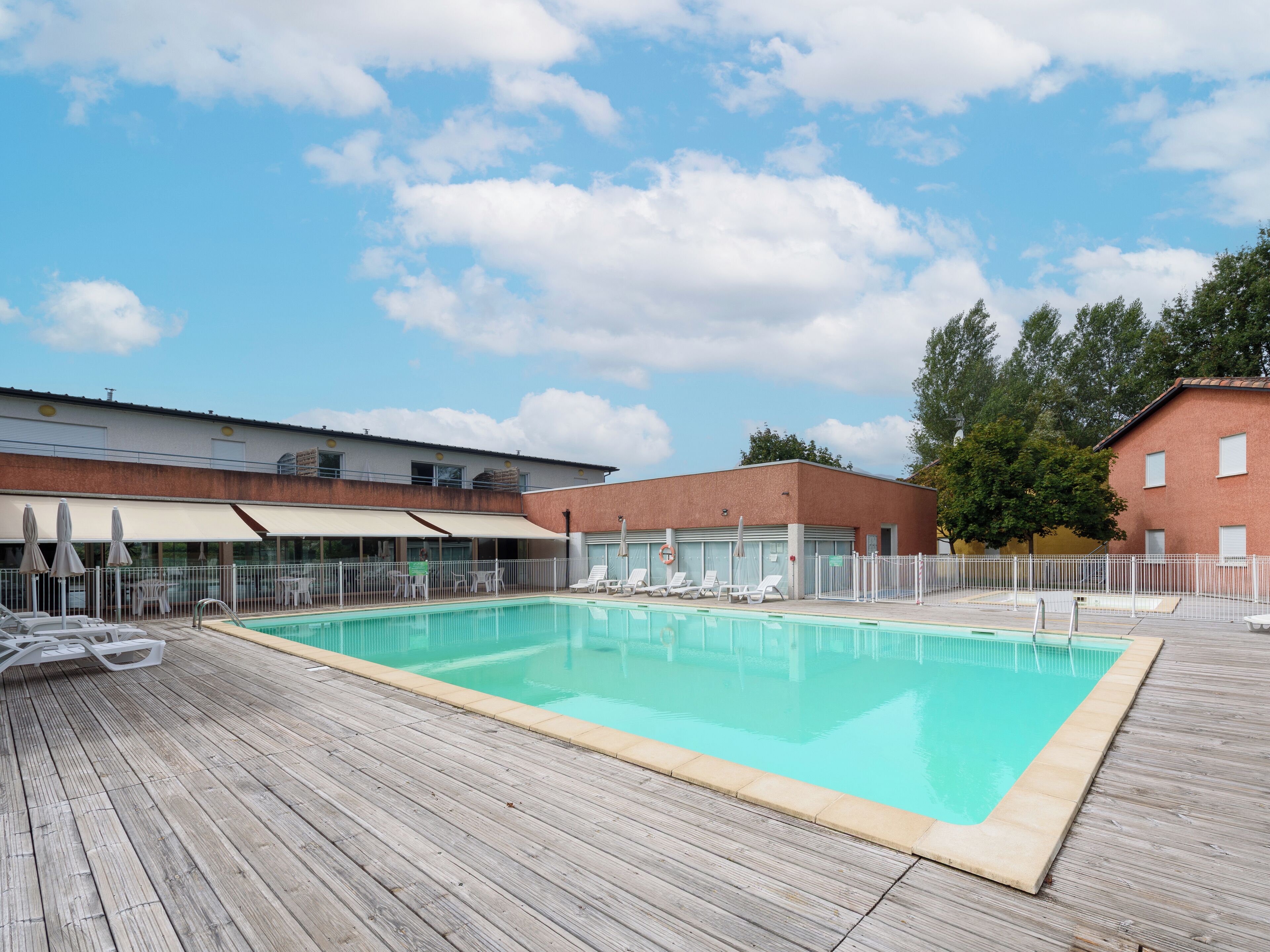 Seasonal outdoor pool, open 9:00 AM to 8:00 PM, pool umbrellas