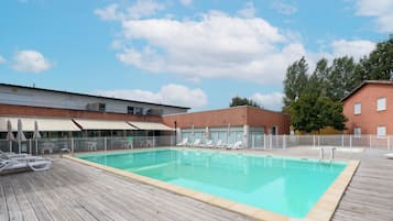 Seasonal outdoor pool, open 9:00 AM to 8:00 PM, pool umbrellas