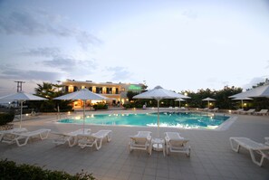 Outdoor pool, open 6 AM to 9 PM, pool umbrellas, pool loungers