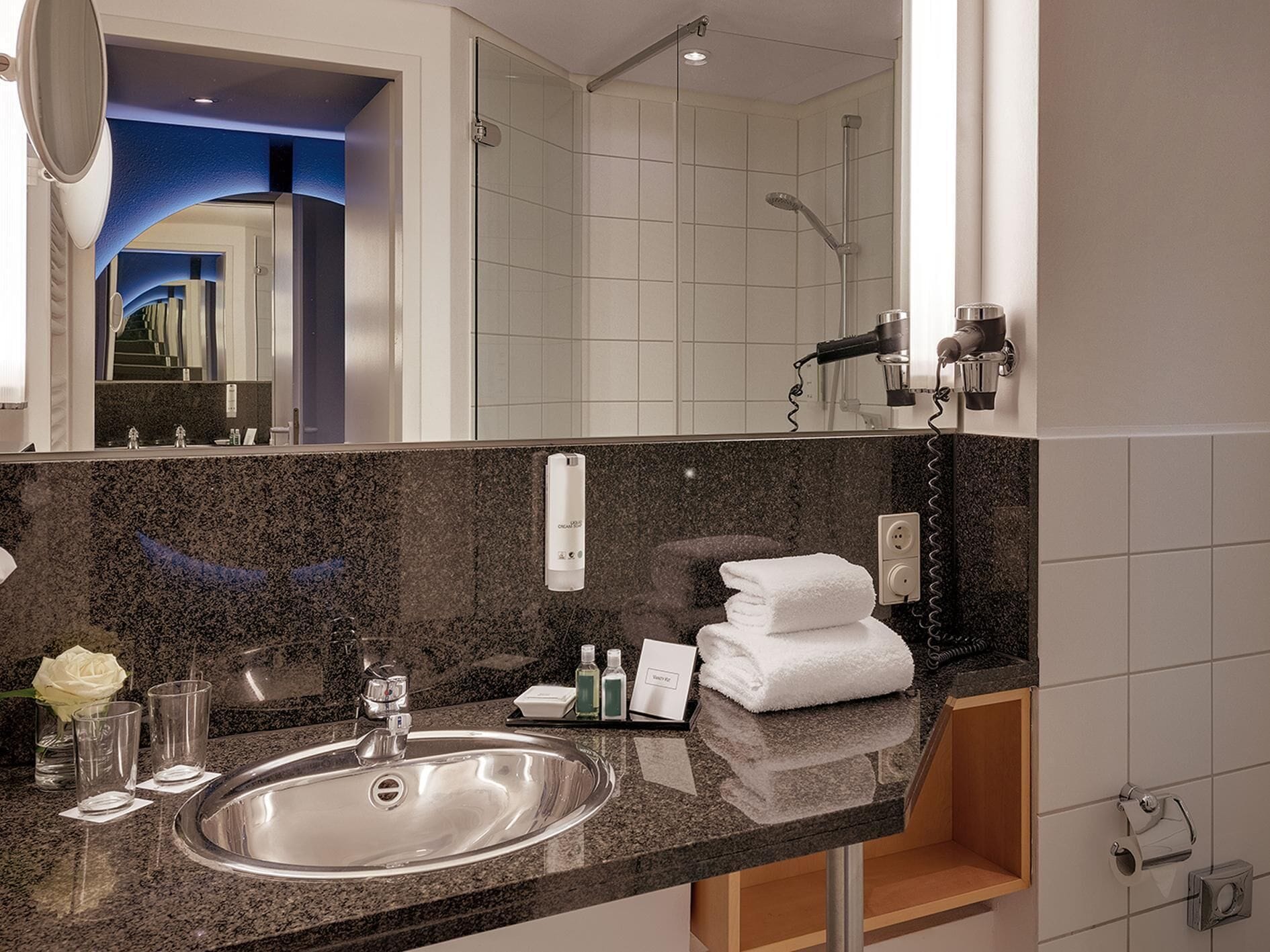 hair dryer, towels, soap, shampoo