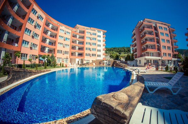 Outdoor pool, open 8 AM to 9 PM, pool umbrellas, pool loungers