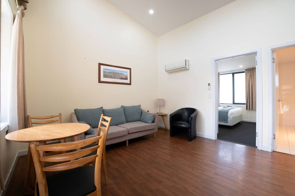 One Bedroom Apartment | Living area | 40-inch flat-screen TV with digital channels
