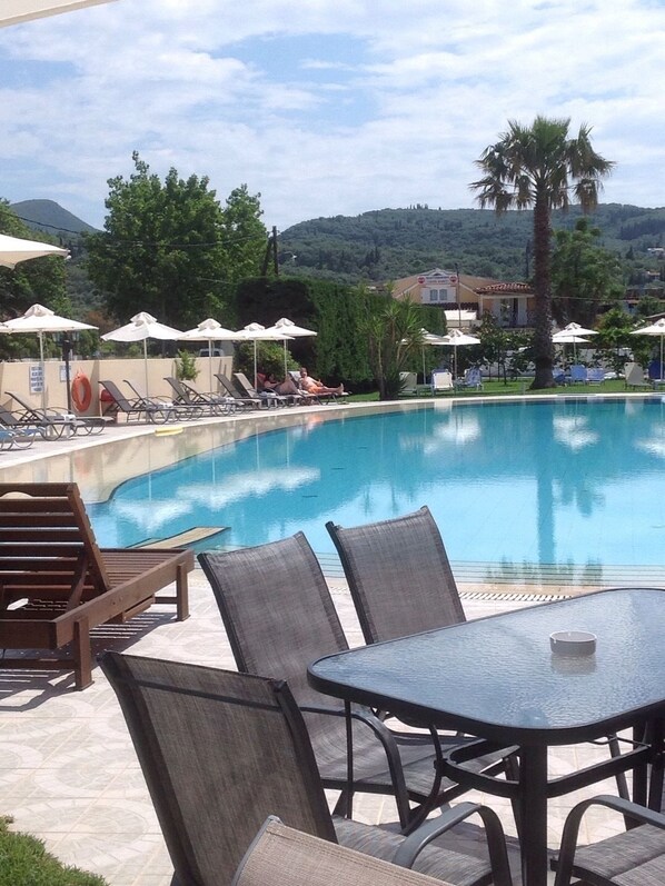 Outdoor pool, pool umbrellas, pool loungers