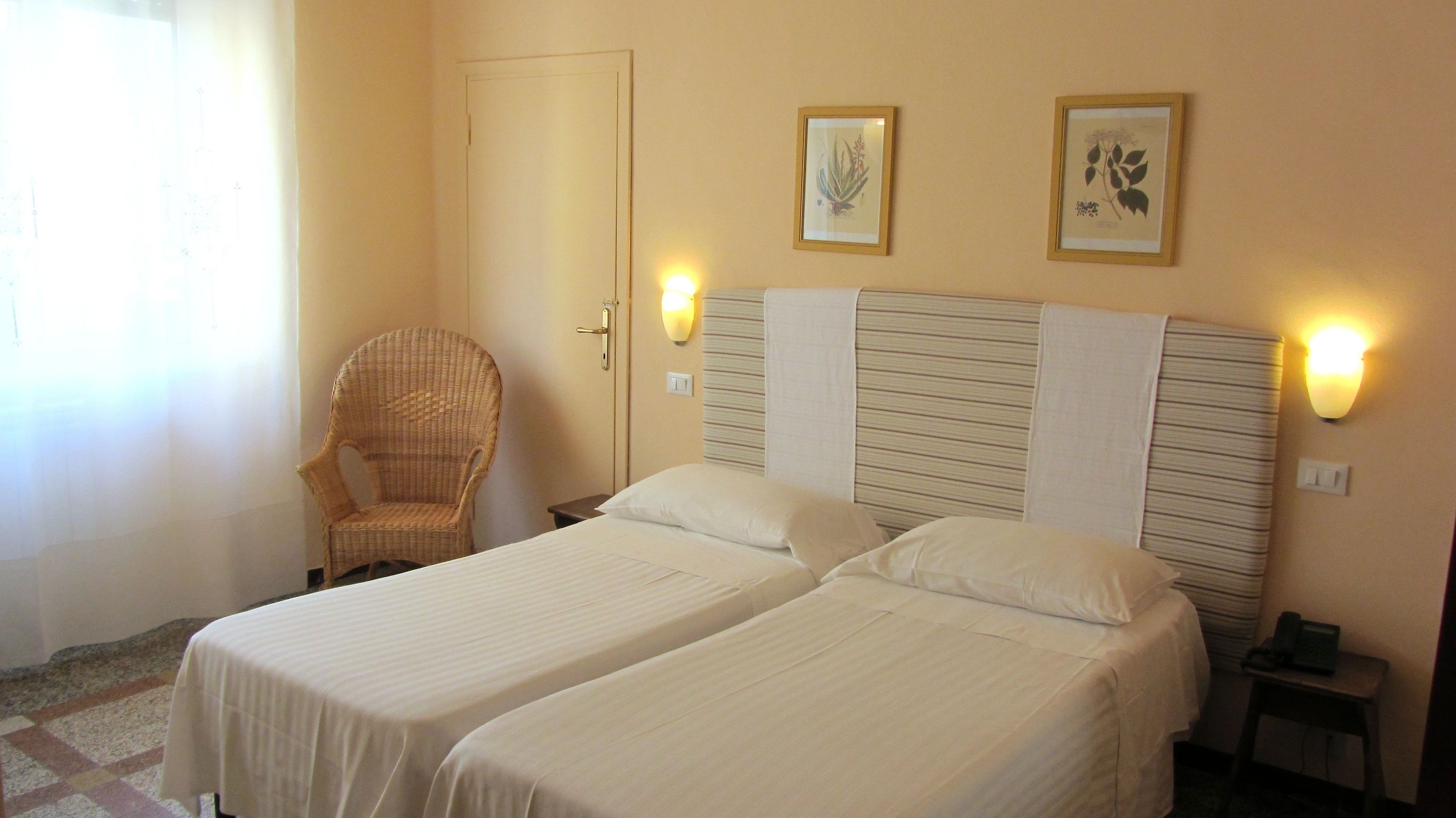 Classic Double Room | Minibar, in-room safe, desk, cots/infant beds