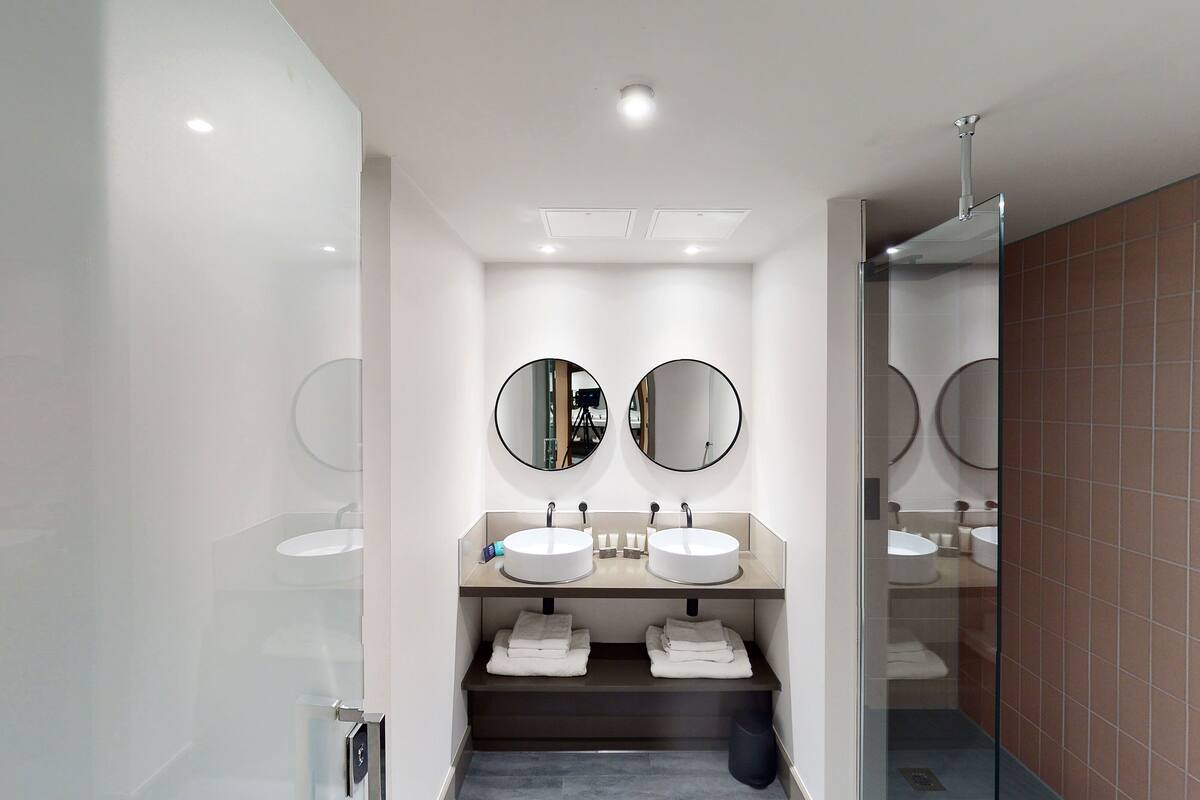 suite | bathroom | shower, rainfall showerhead, hair dryer, slippers