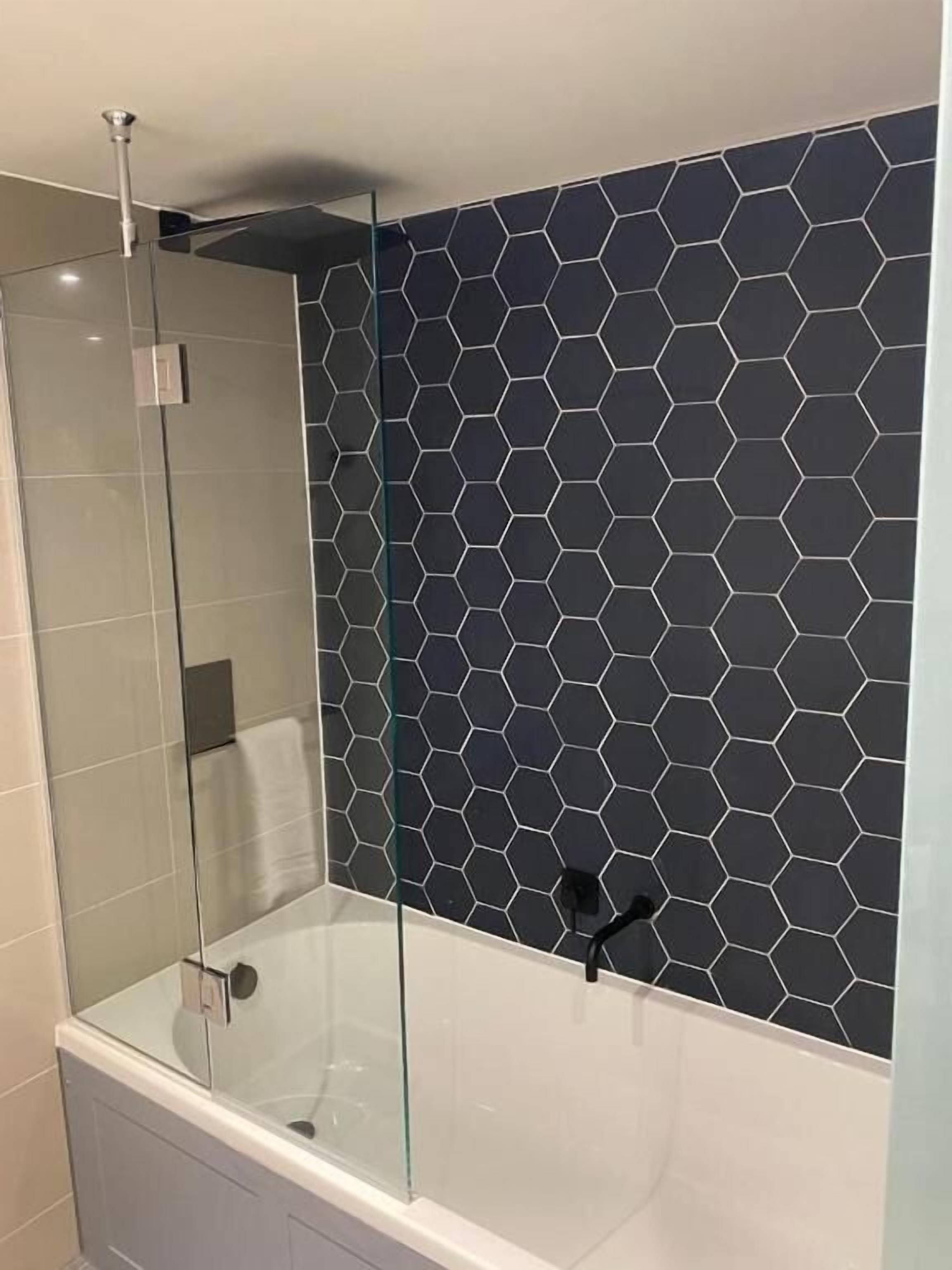 junior king suites | bathroom | shower, rainfall showerhead, hair dryer, slippers