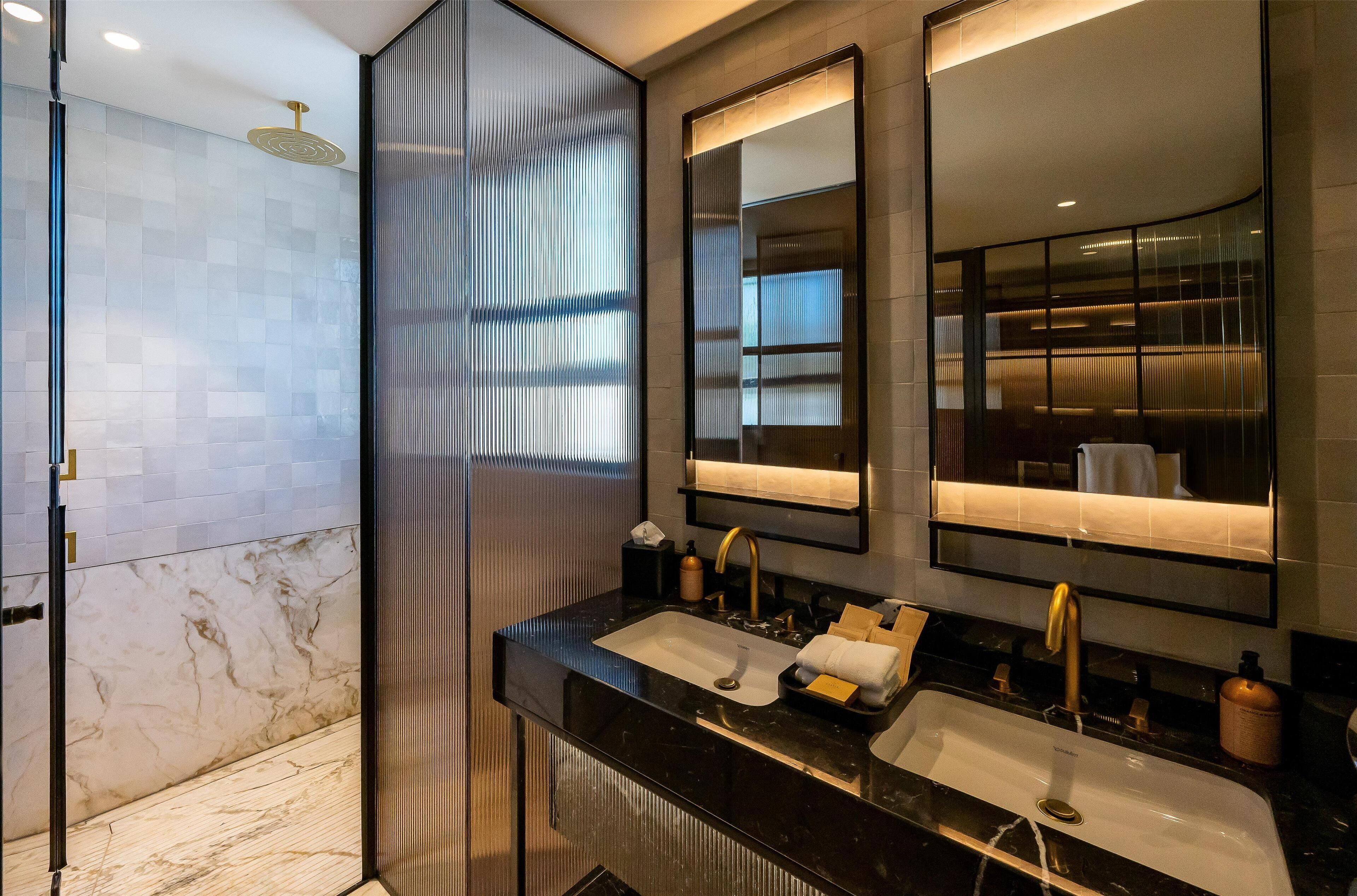 separate bathtub and shower, deep-soaking bathtub, designer toiletries