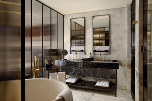 Separate tub and shower, deep soaking tub, designer toiletries