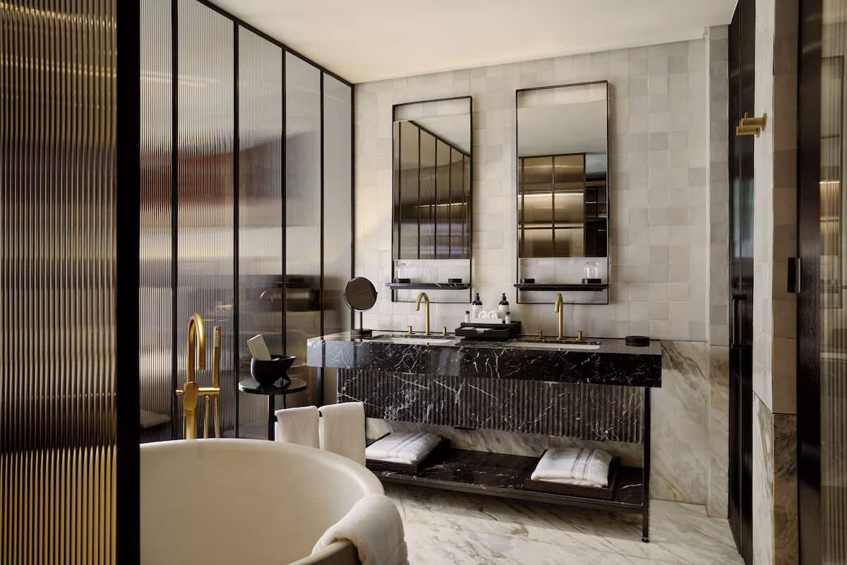 Separate tub and shower, deep soaking tub, designer toiletries