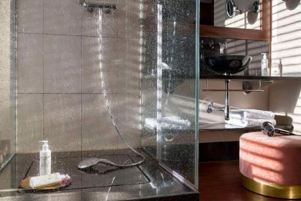 Bathroom | Shower, designer toiletries, hair dryer, slippers