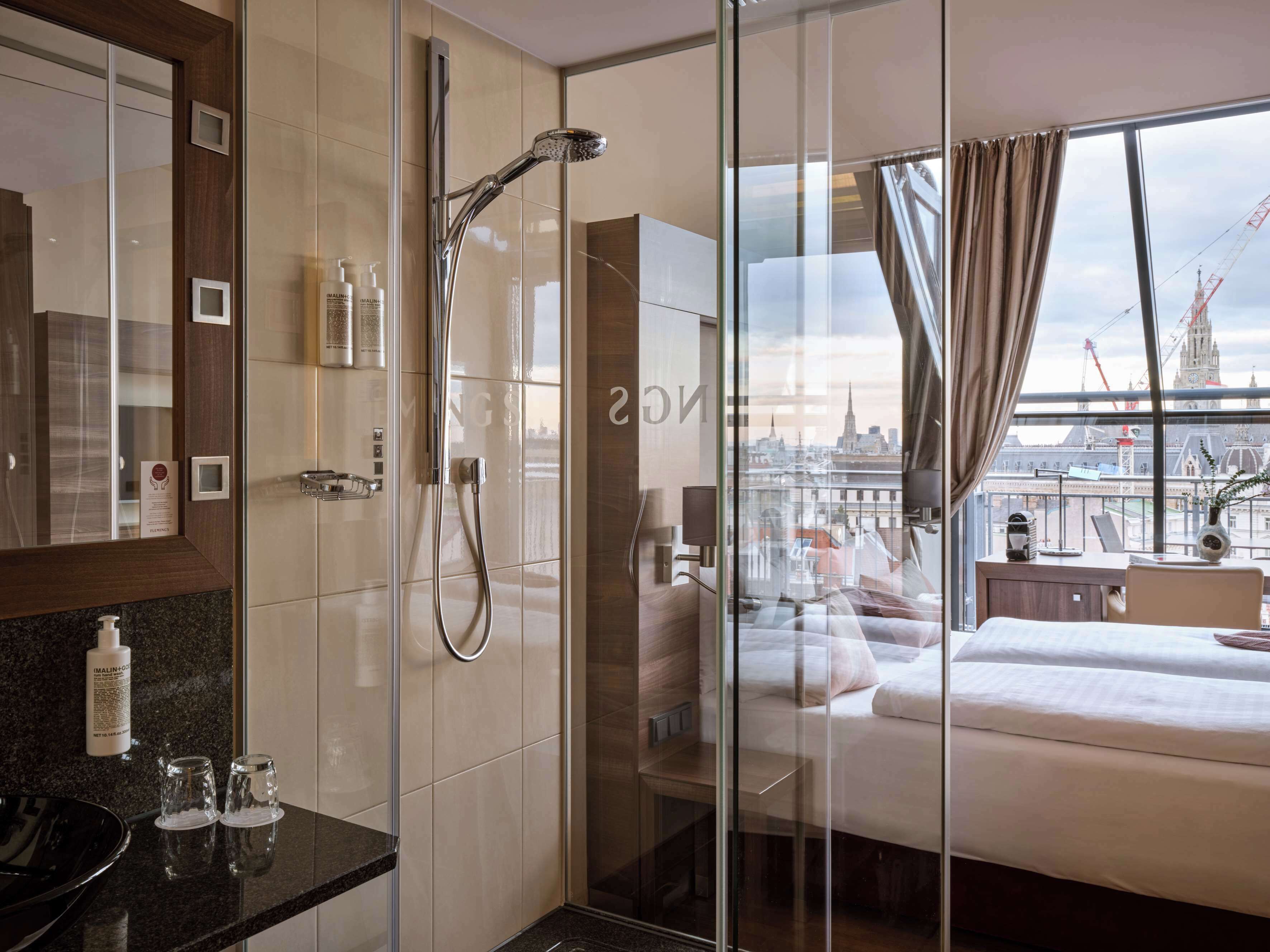 signature double room, balcony, city view | bathroom | shower, designer toiletries, hair dryer, slippers