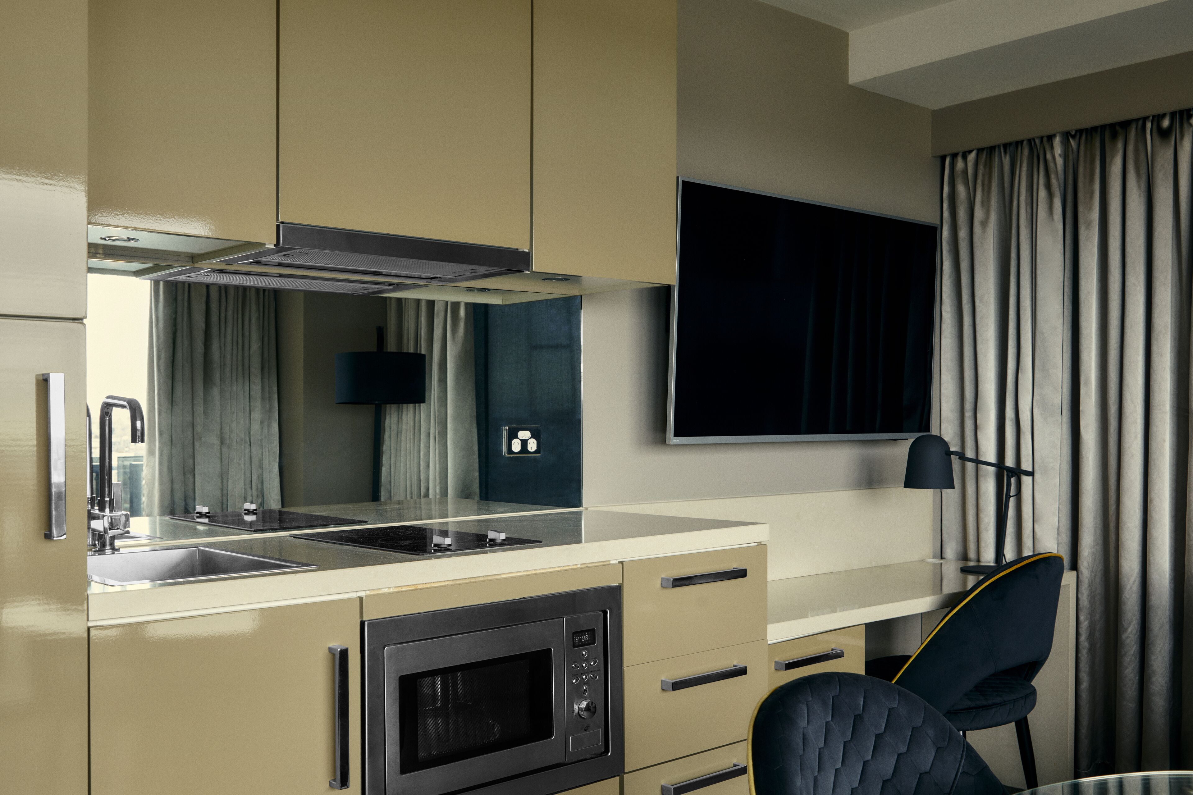 mini-fridge, microwave, stovetop, toaster