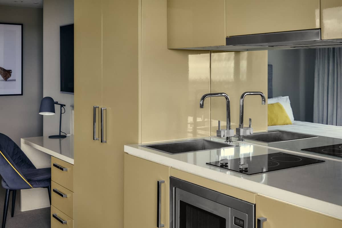 mini-fridge, microwave, stovetop, toaster