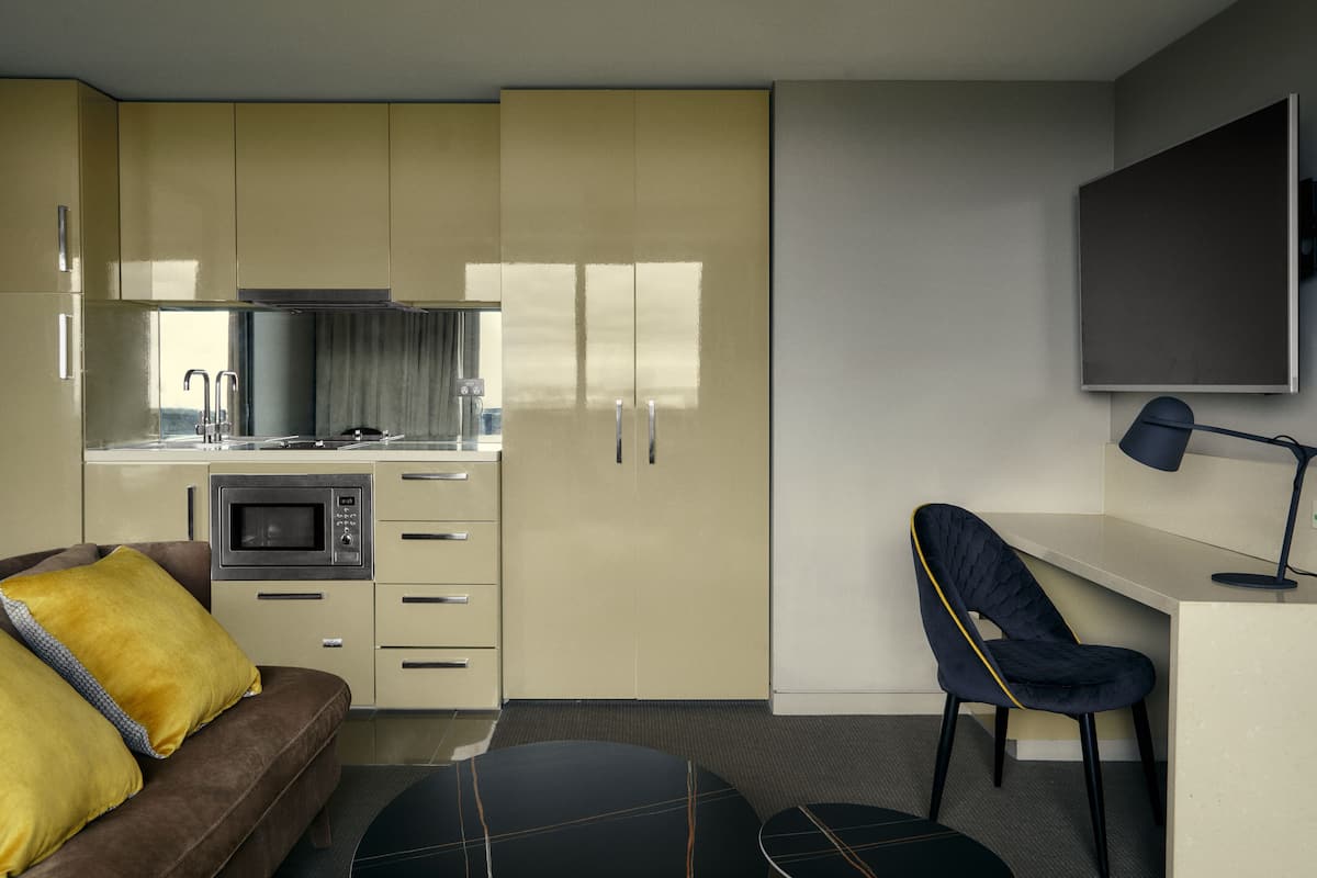 mini-fridge, microwave, stovetop, toaster