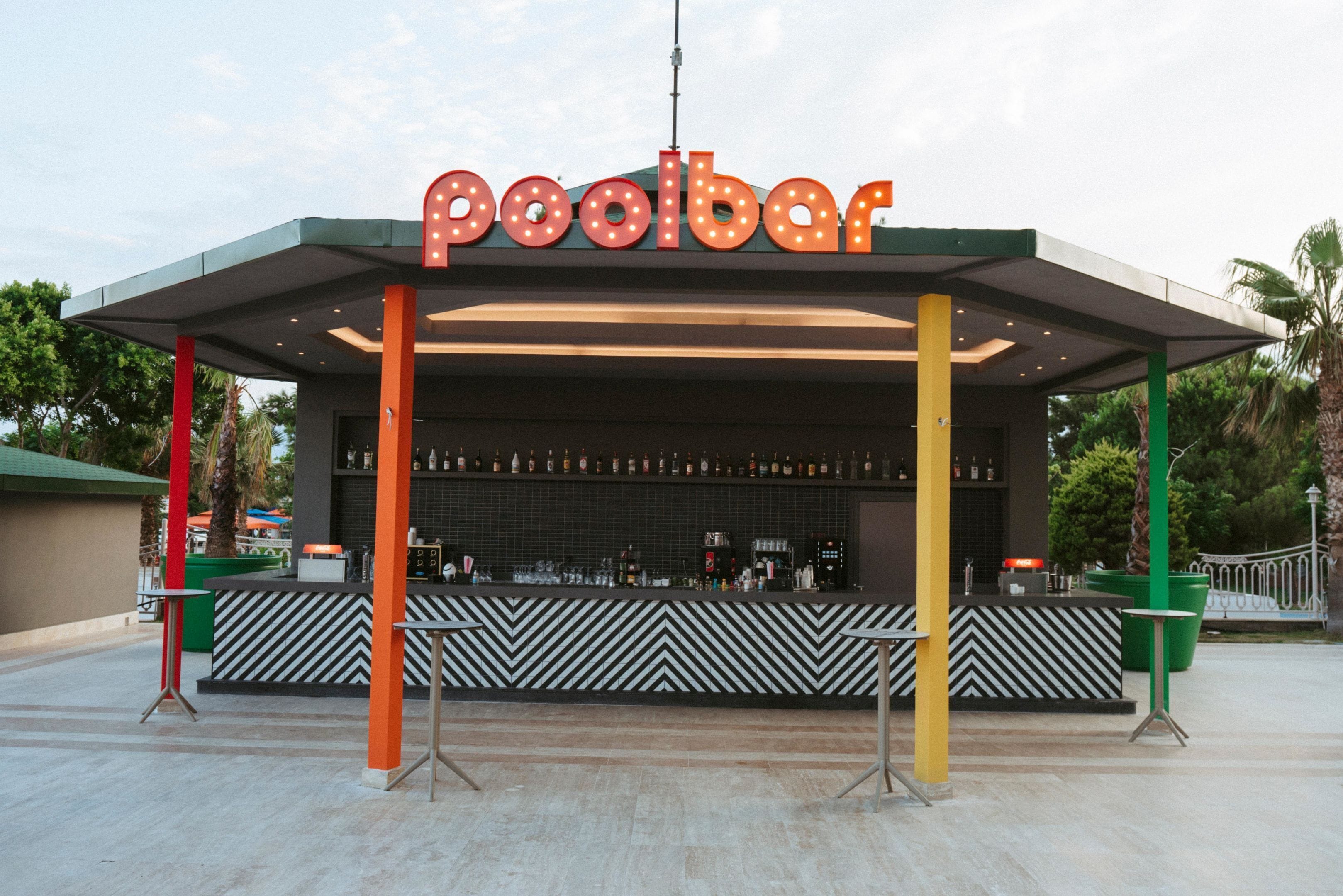 A pool bar with a chevron-patterned counter and a sign above.