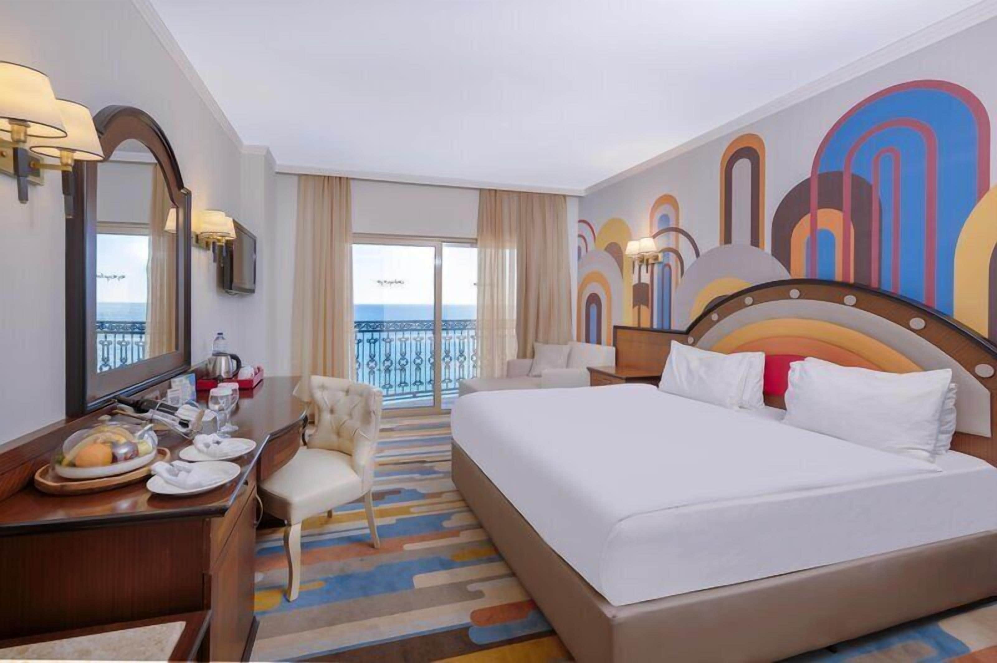 Deluxe Room, Sea View | Premium bedding, minibar (free items), in-room safe, desk