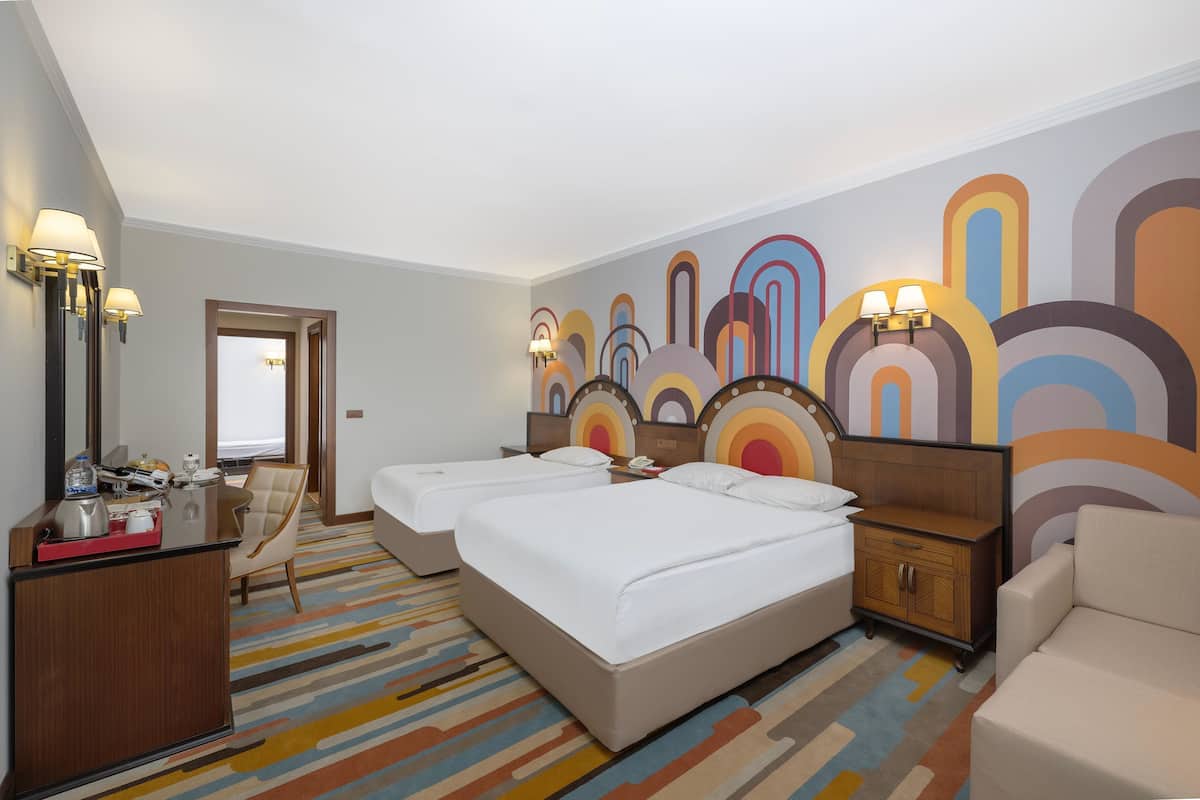 Family Room | Premium bedding, free minibar, in-room safe, desk