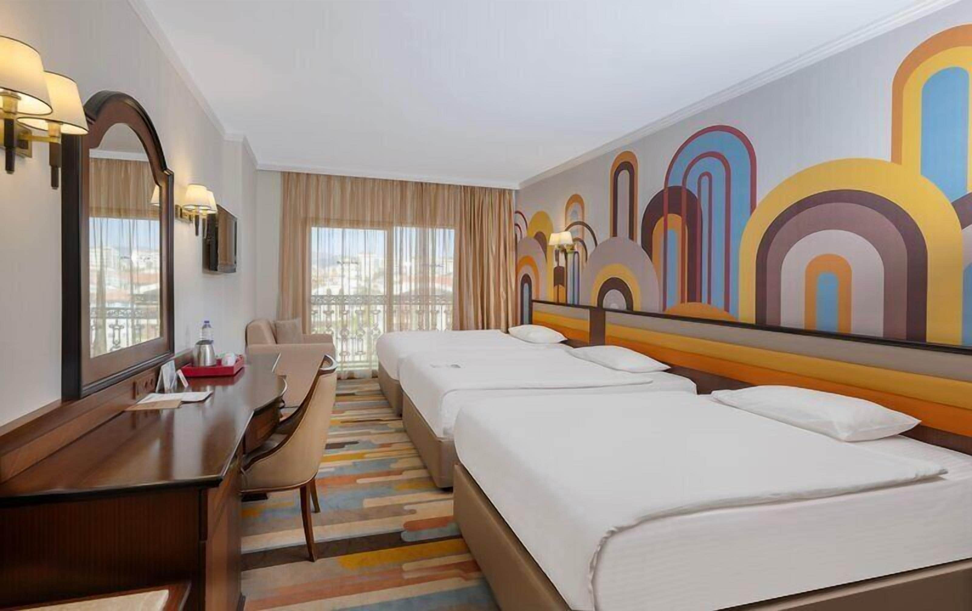 Deluxe Triple Room, City View | Premium bedding, minibar (free items), in-room safe, desk