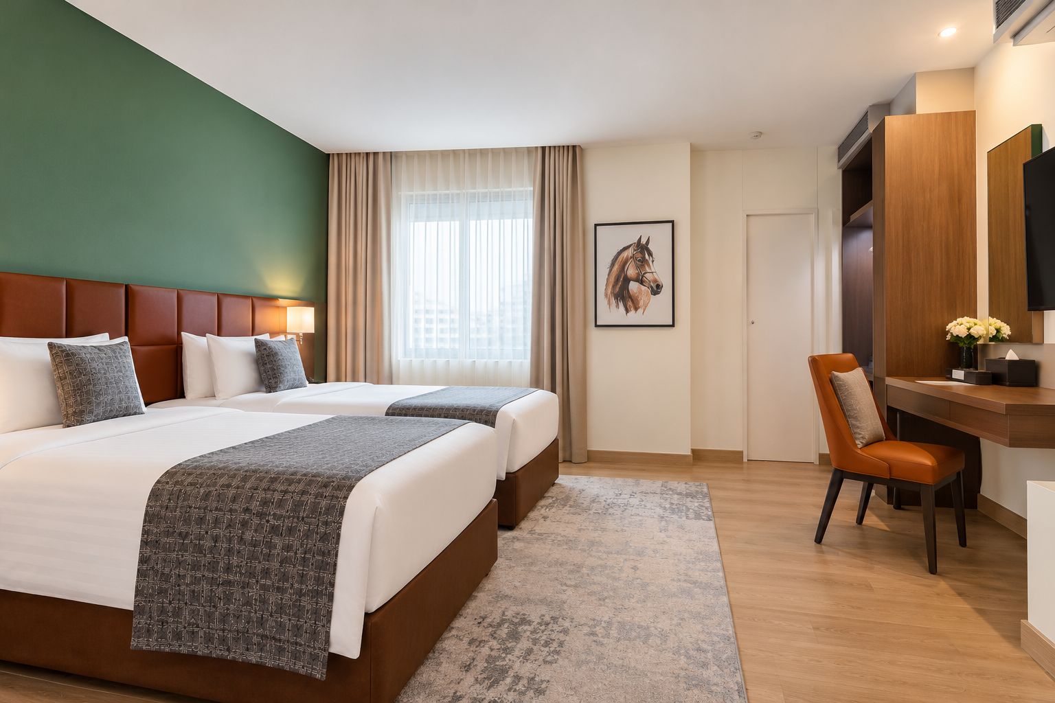 A hotel room with two beds, a desk, a chair, a large window with curtains, and a mounted television.
