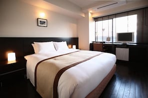 Premium bedding, down duvets, in-room safe, desk
