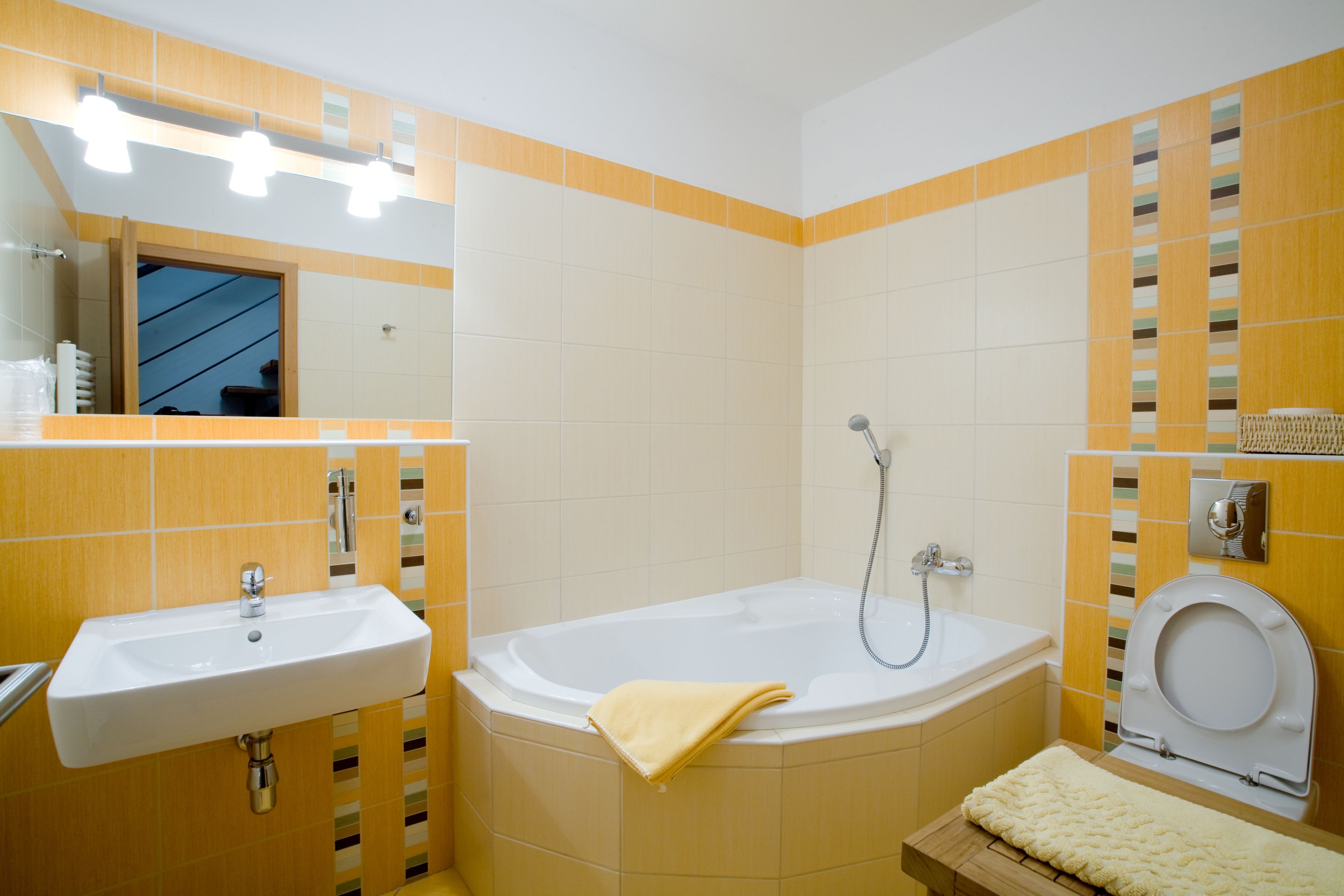 A bathroom with a sink, bathtub, and toilet.