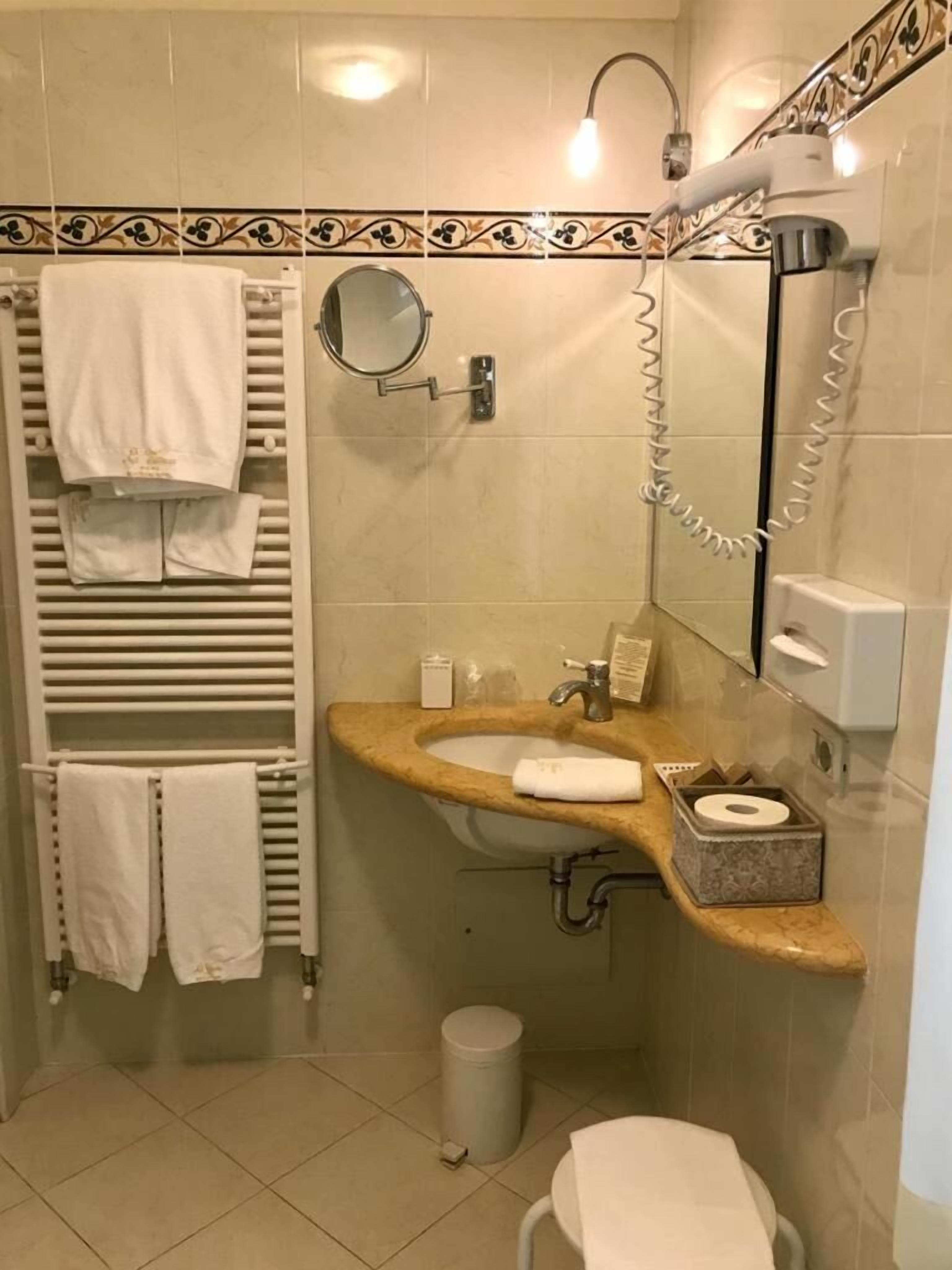 hair dryer, slippers, bidet, towels