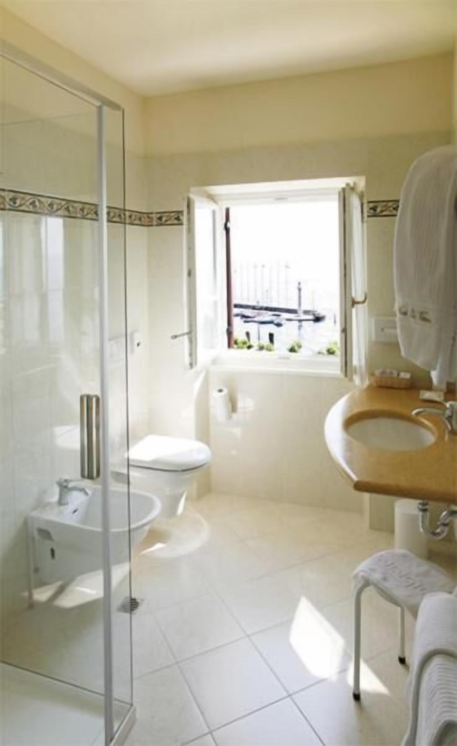 hair dryer, slippers, bidet, towels