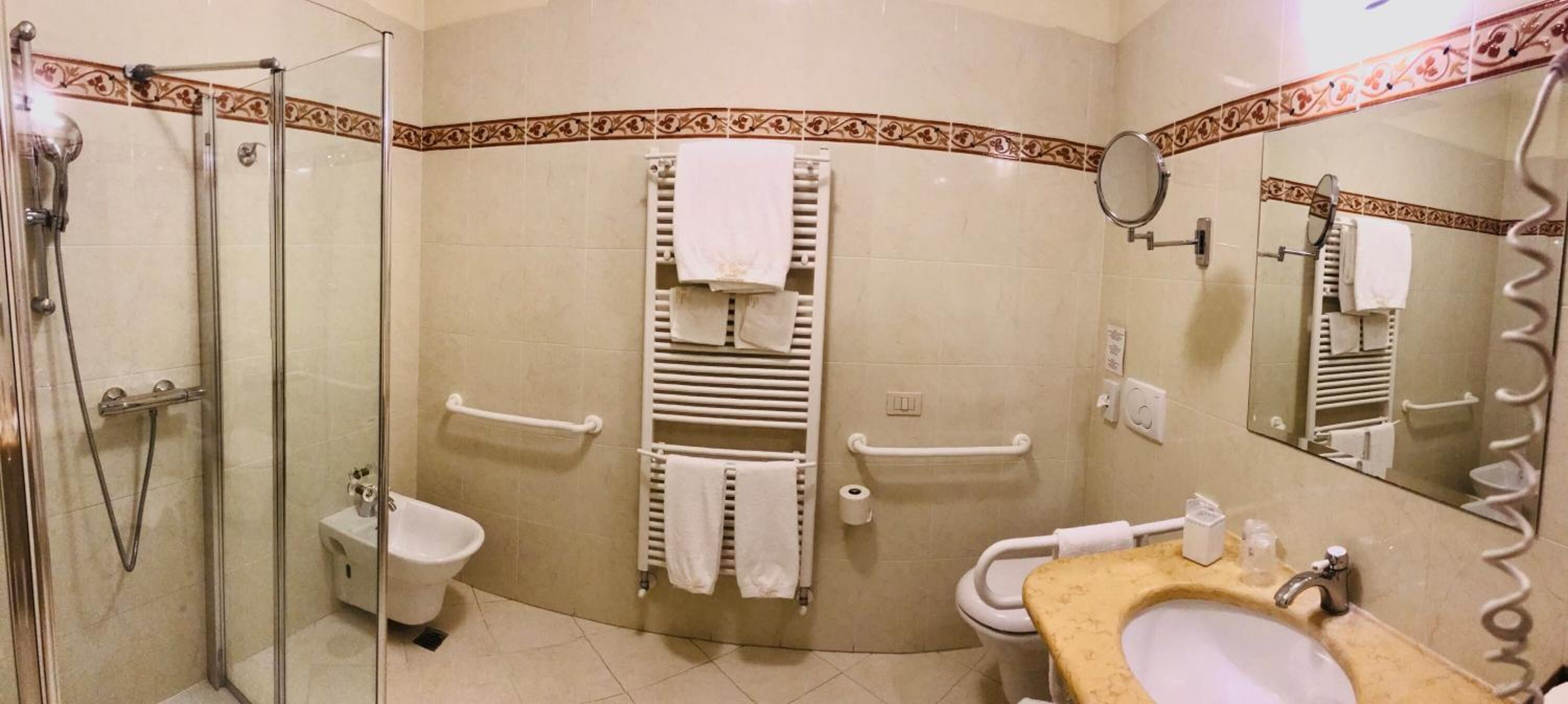 hair dryer, slippers, bidet, towels