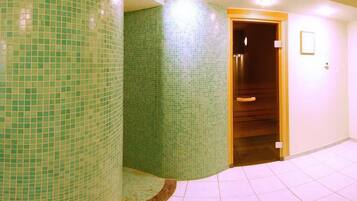 Comfortable retreat with a green-tiled wall, wooden door, and a cozy rug.