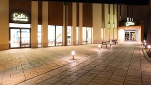 A brightly lit building facade with signage for 'Cafe Restaurant' and 'La Casa'. - Grand Laola Spa (Rewal)