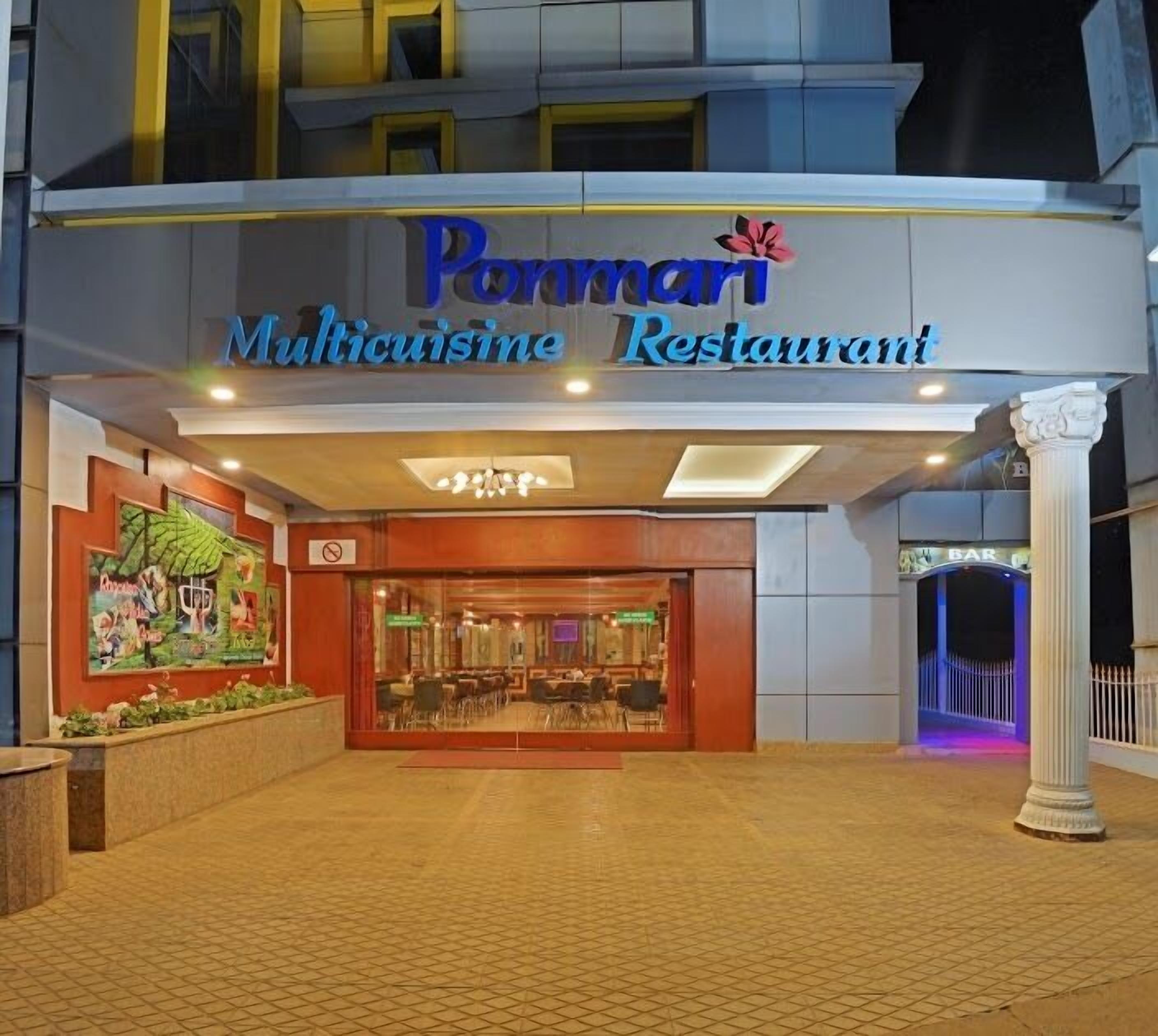A restaurant entrance with a sign reading "Pannari Multicuisine Restaurant."