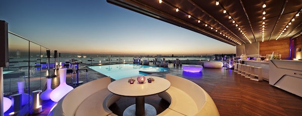A rooftop pool area with modern seating and a view of the city skyline. - Doubletree by Hilton Istanbul Moda (Istanbul)
