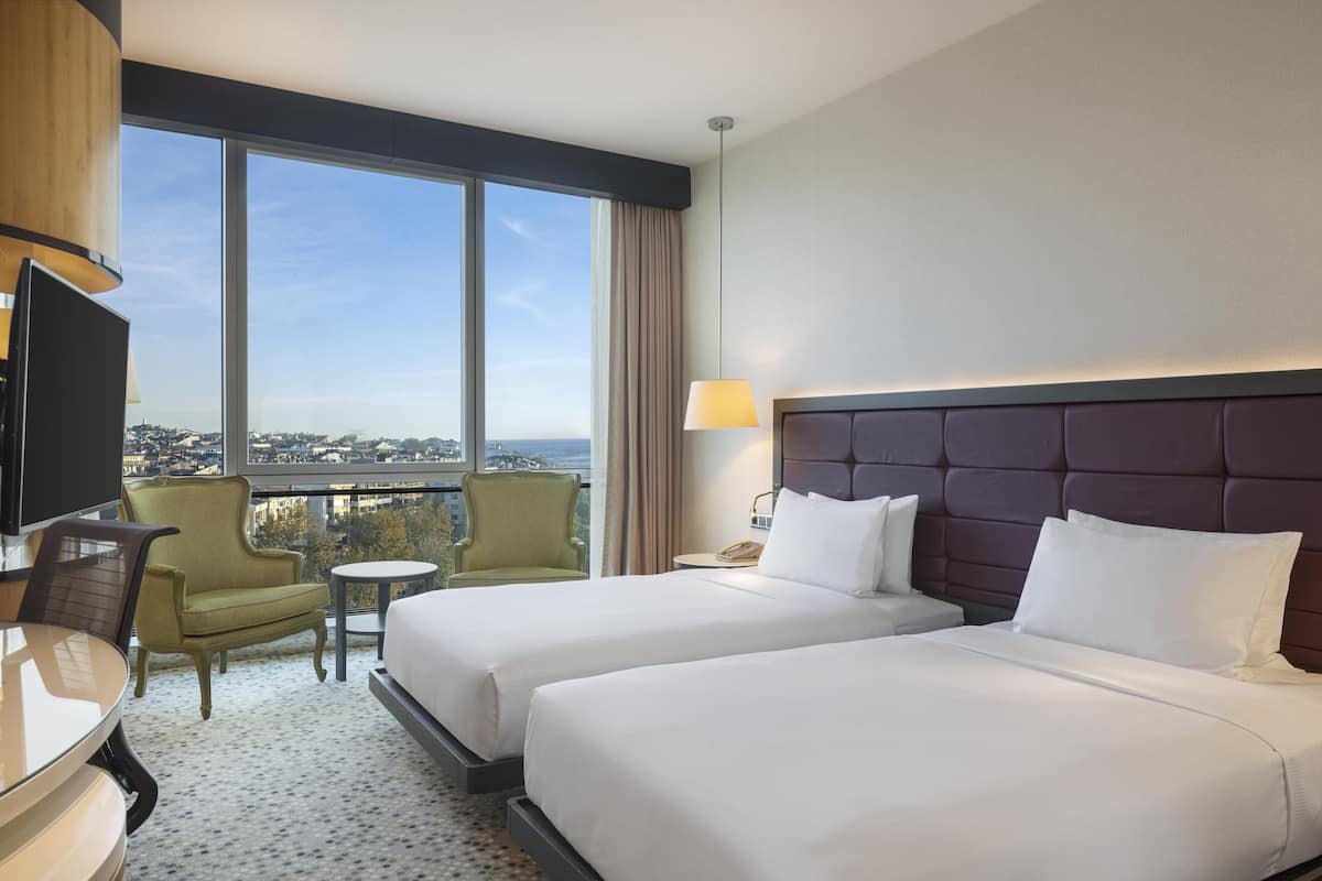 Deluxe Room, Sea View | Premium bedding, in-room safe, laptop workspace, blackout drapes