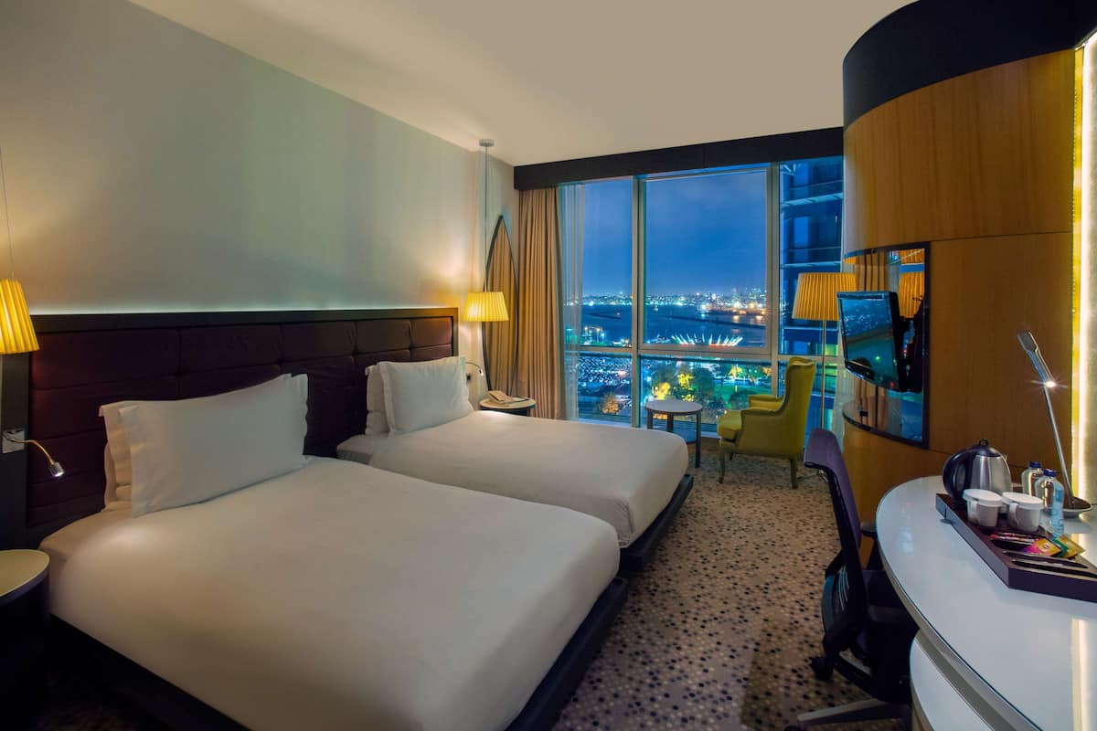 Deluxe Room, Sea View | Premium bedding, in-room safe, laptop workspace, blackout drapes
