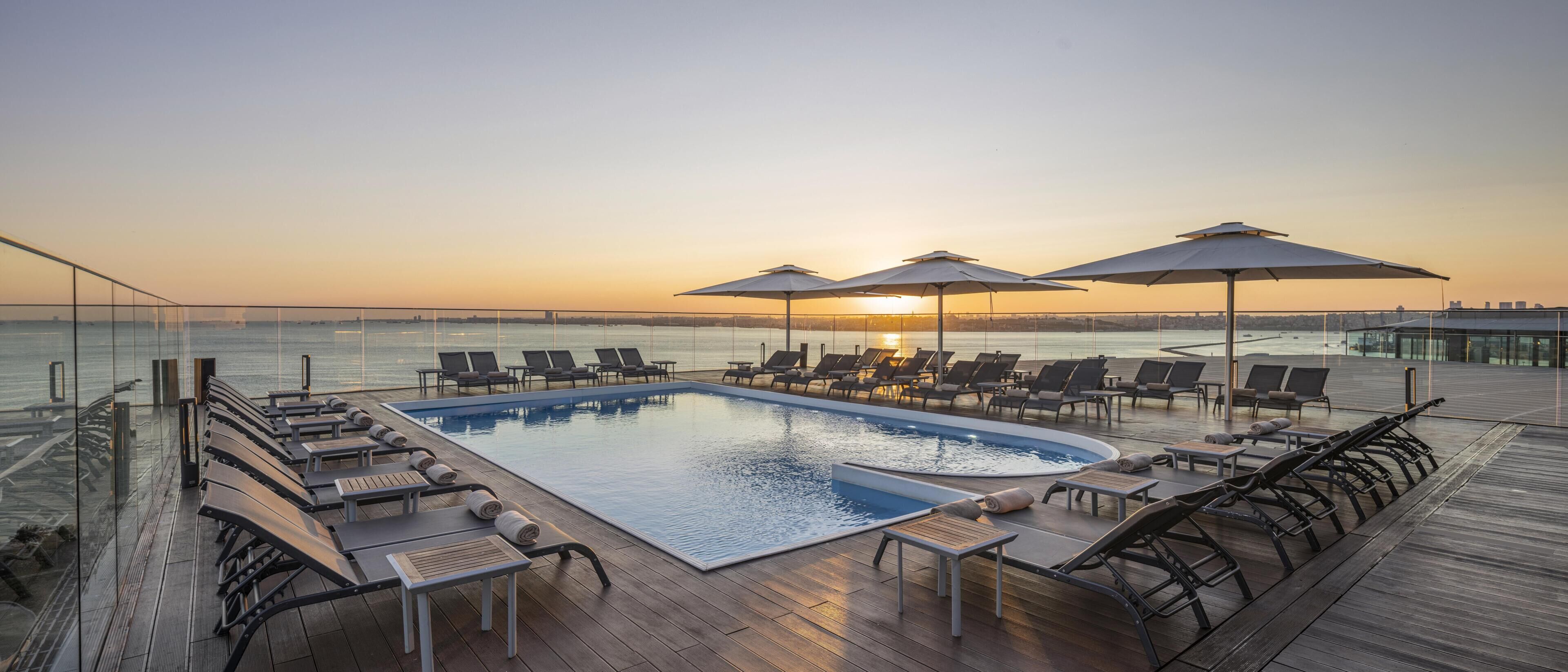 Indoor pool, seasonal outdoor pool, pool umbrellas, sun loungers