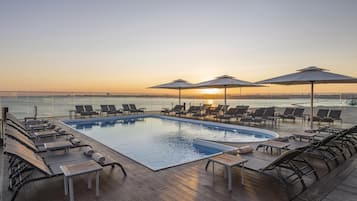 Indoor pool, seasonal outdoor pool, pool umbrellas, sun loungers