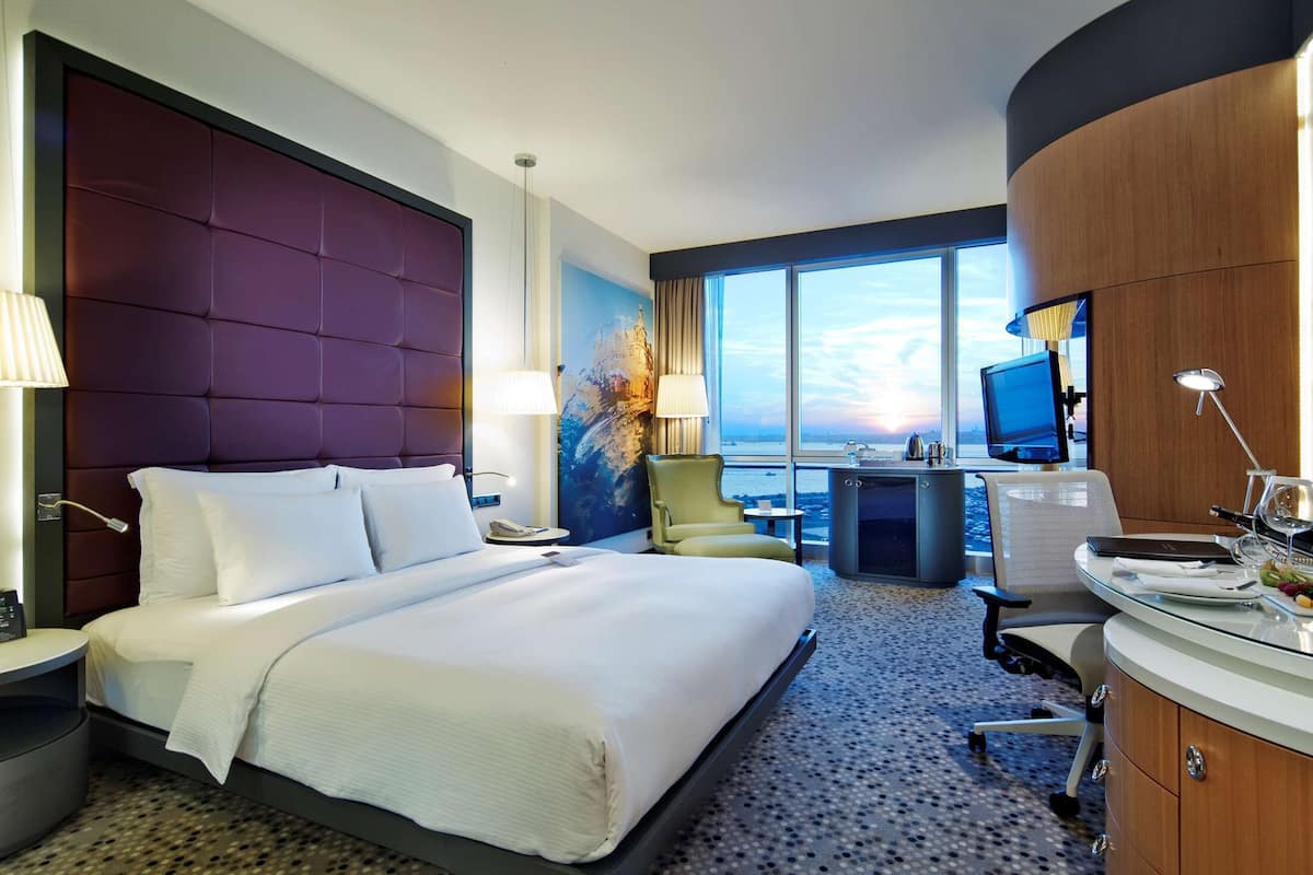 Deluxe Room, 1 King Bed, Sea View | Premium bedding, in-room safe, laptop workspace, blackout drapes