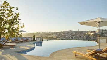 Indoor pool, seasonal outdoor pool, pool umbrellas, sun loungers