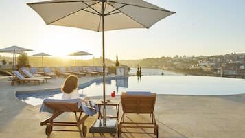 Indoor pool, seasonal outdoor pool, pool umbrellas, sun loungers