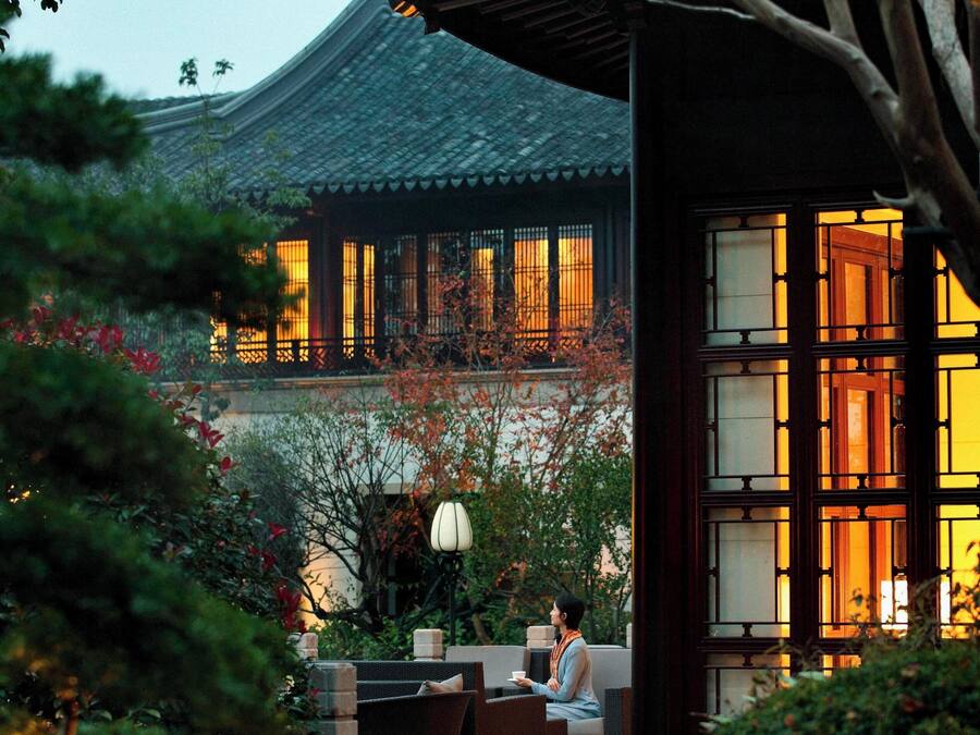 A traditional building with a tiled roof and wooden lattice windows.