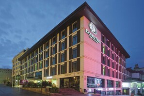 A hotel with a modern facade, multiple floors, and a prominent sign for 'DoubleTree by Hilton'. - Doubletree By Hilton Istanbul Old Town (Istanbul)