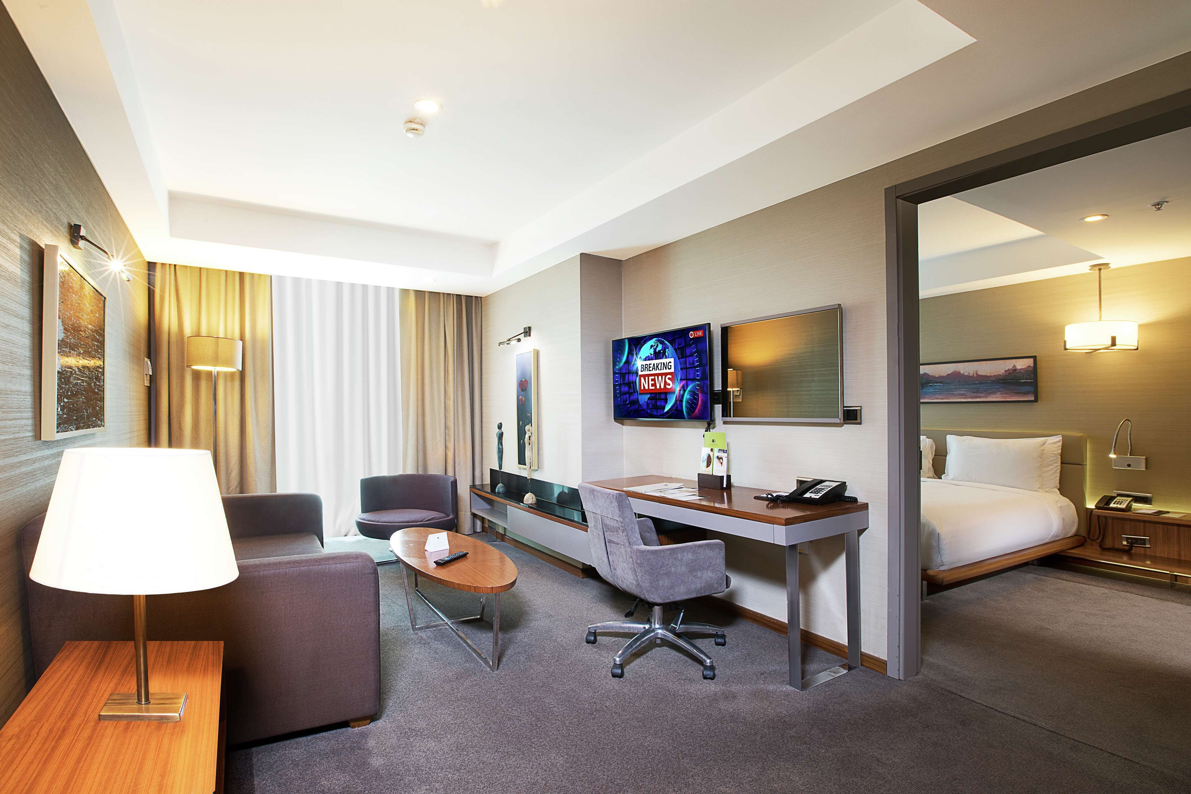suite, 1 king bed (with separate living room) | premium bedding, minibar, in-room safe, desk