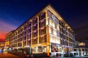 A hotel with a modern facade, multiple stories, and illuminated signage. - Doubletree By Hilton Istanbul Old Town (Istanbul)