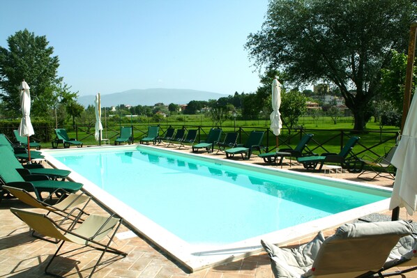 Seasonal outdoor pool, open 8:00 AM to 8:00 PM, free pool cabanas