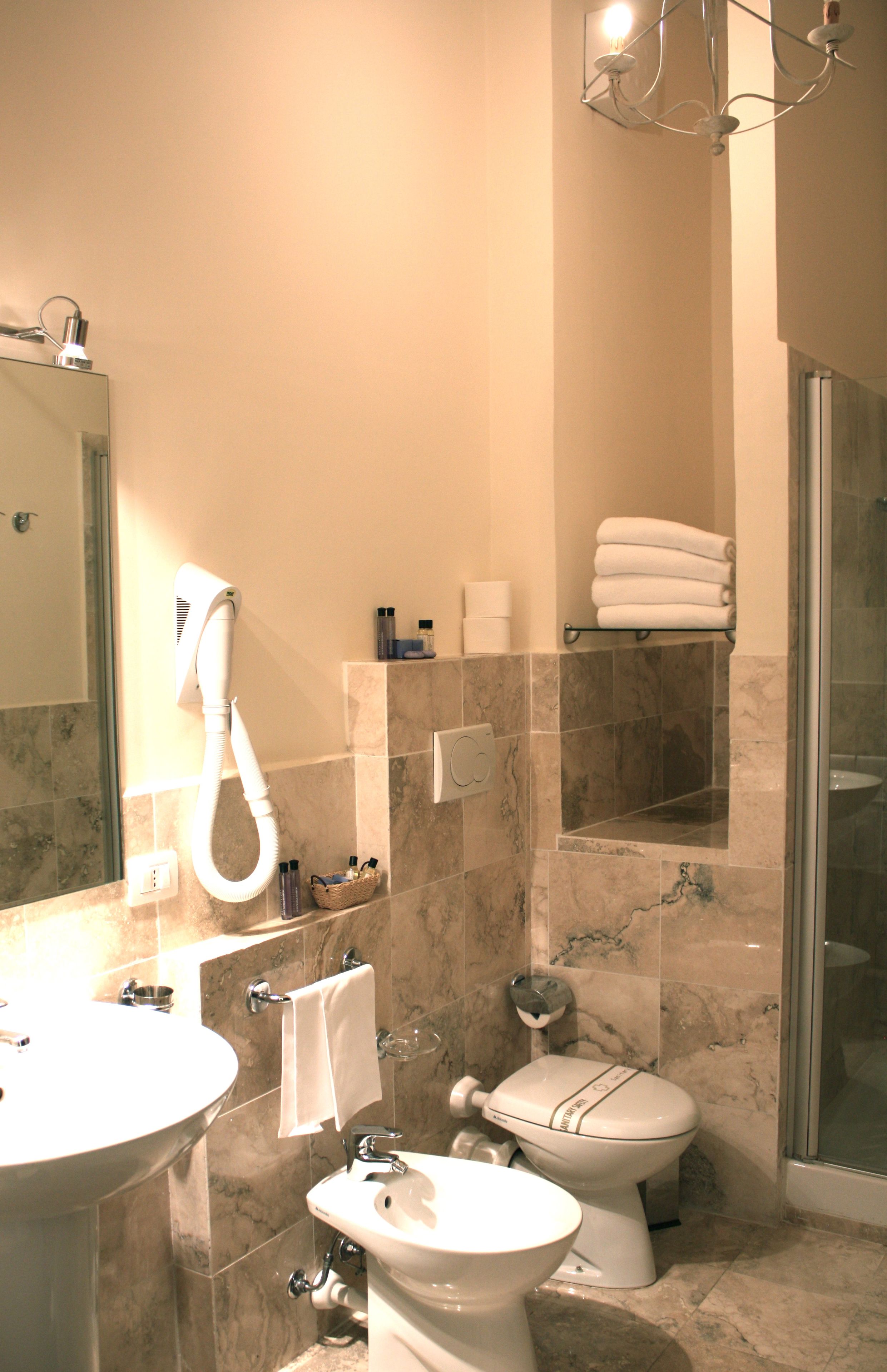 shower, designer toiletries, hair dryer, bidet