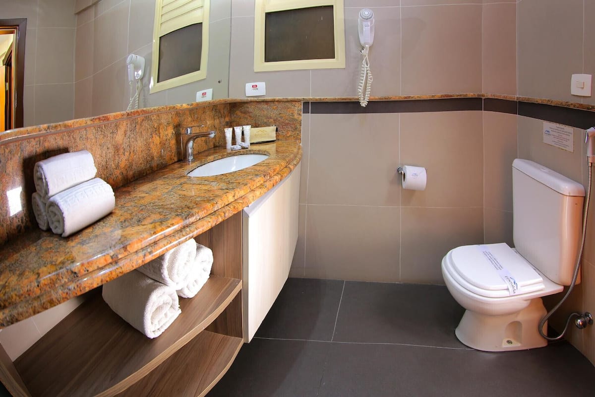 bathroom | shower, designer toiletries, hair dryer, towels