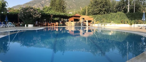 Seasonal outdoor pool, pool umbrellas