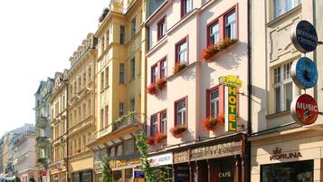 A hotel with a signboard, a café, and a restaurant.